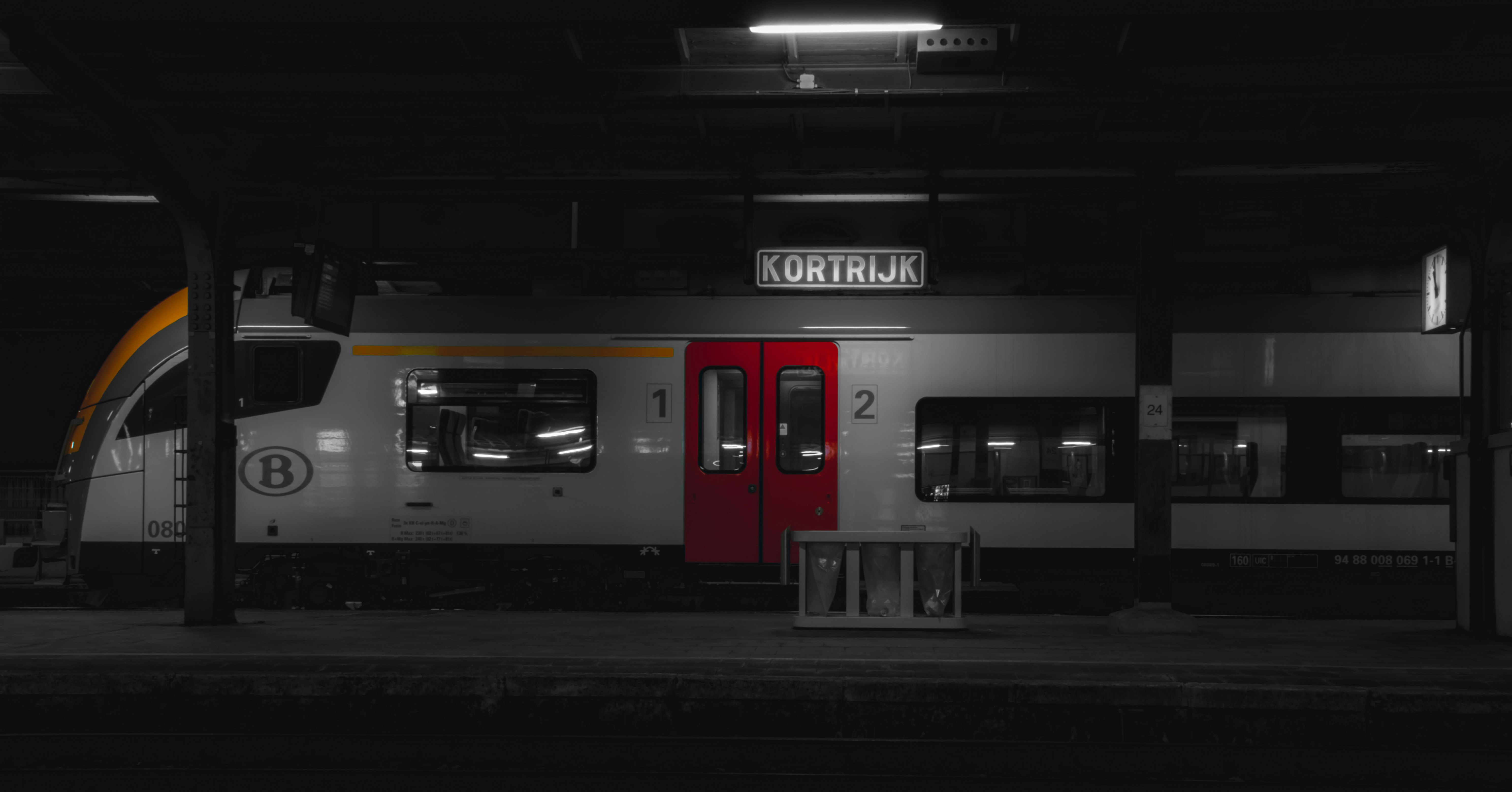 black and white train in a dark room